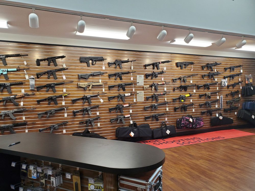 Used firearms racked at Target Shooting Solutions